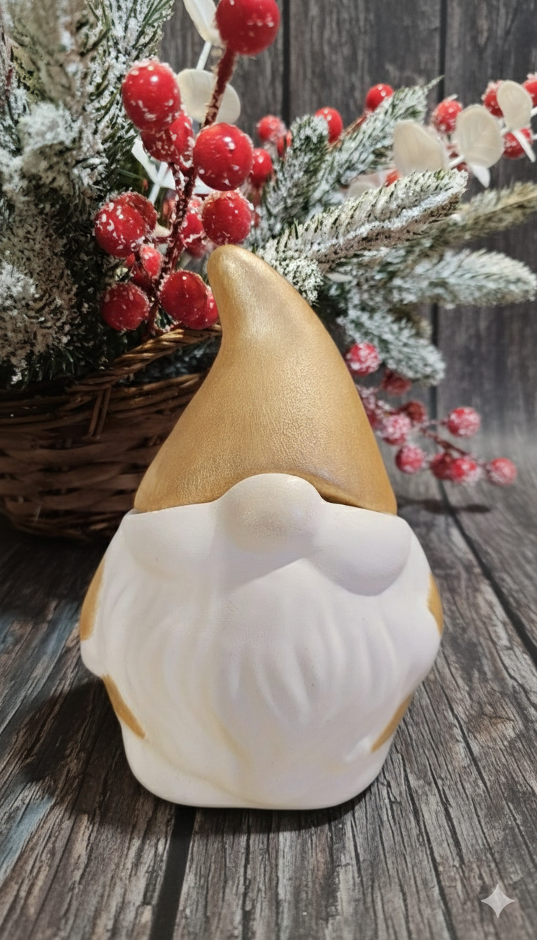 Santa soy candle displayed with festive holiday decor, featuring a handcrafted design with a golden hat.