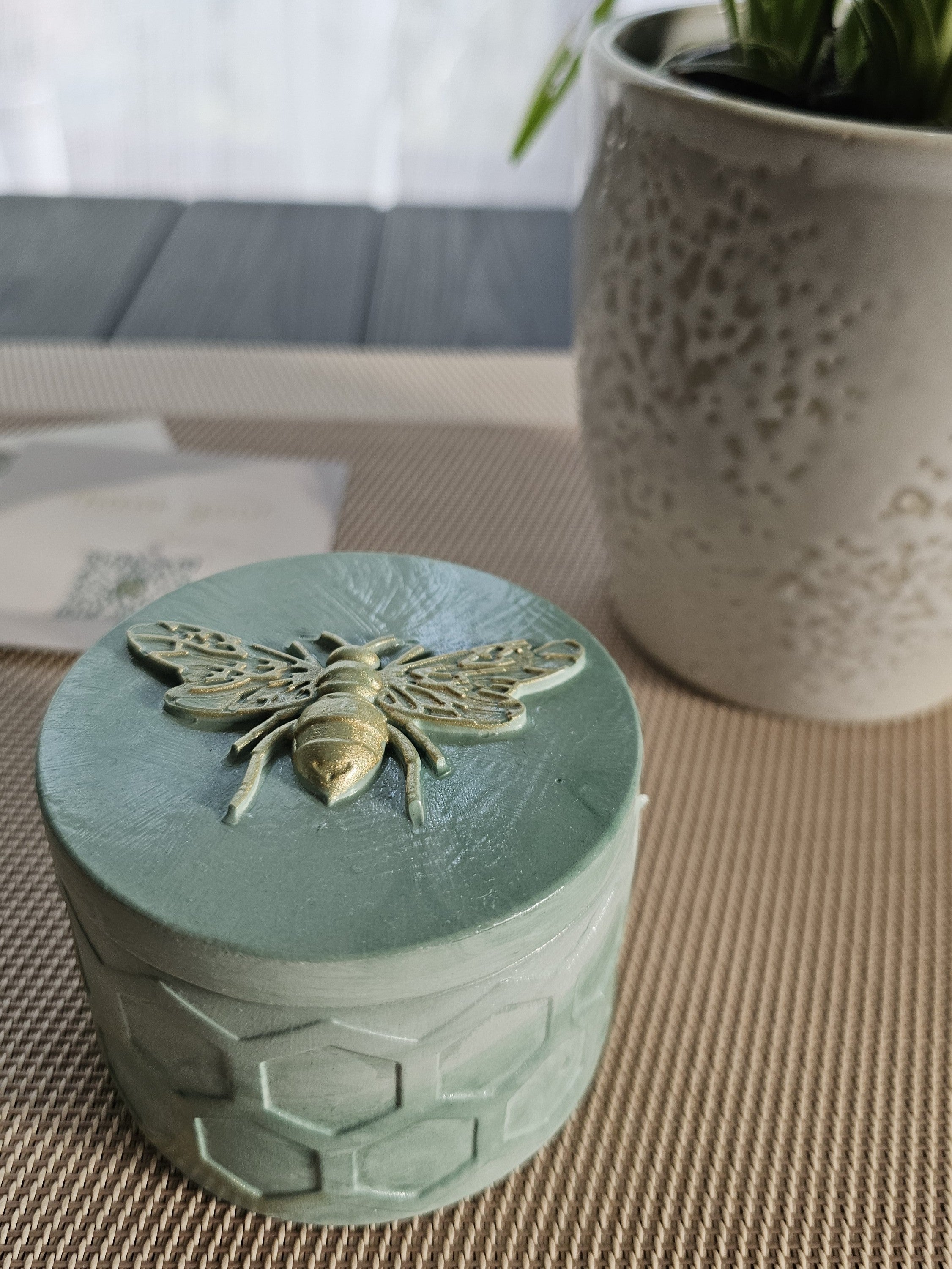 Close-up of Soy Candle with Wooden Wick with golden bee