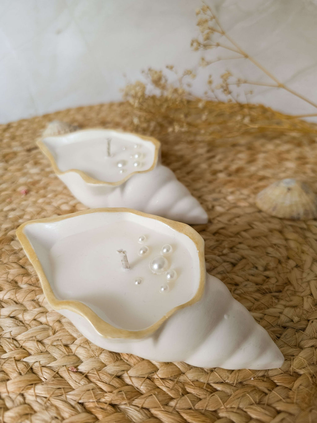 Seashell Gift Set featuring two sculptural candles shaped like elegant shells with golden rims and pearl accents.